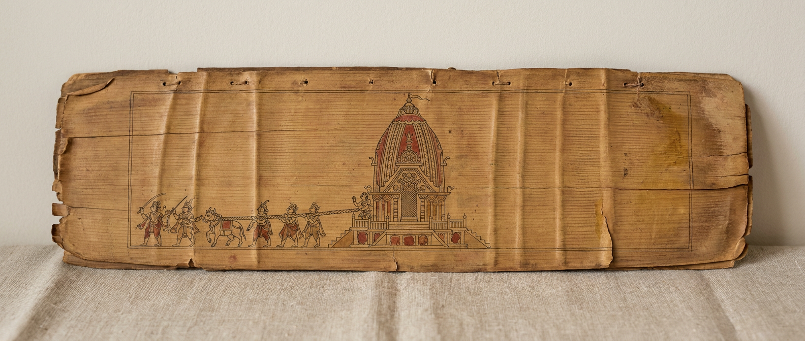 A palm-leaf manuscript: a Kalinga temple and a line of people hauling one rope